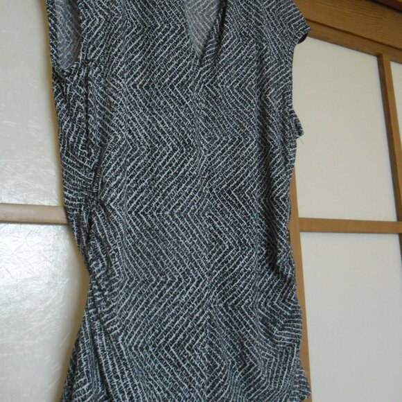 Two tops with ruched sides. Label says small but fits more like a medium. - Picture 2 of 6